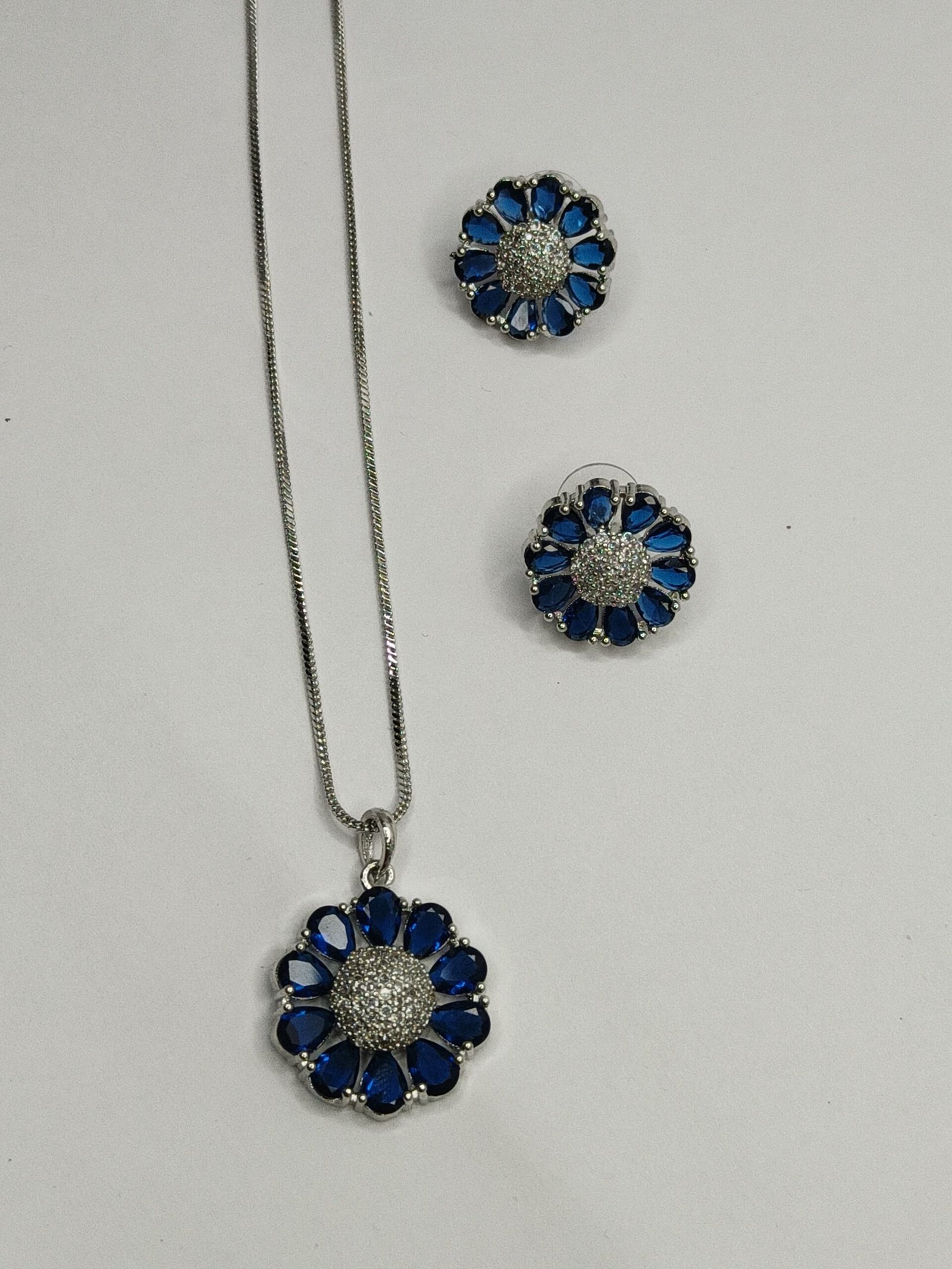 Shahi Pehnawa Rhodium Plated Silver Toned American Diamond Stone Studded Pendant set With Earring Jewellery Set For Women and Girl